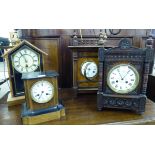 Four late 19th/early 20thC American oak and walnut cased mantle clocks,