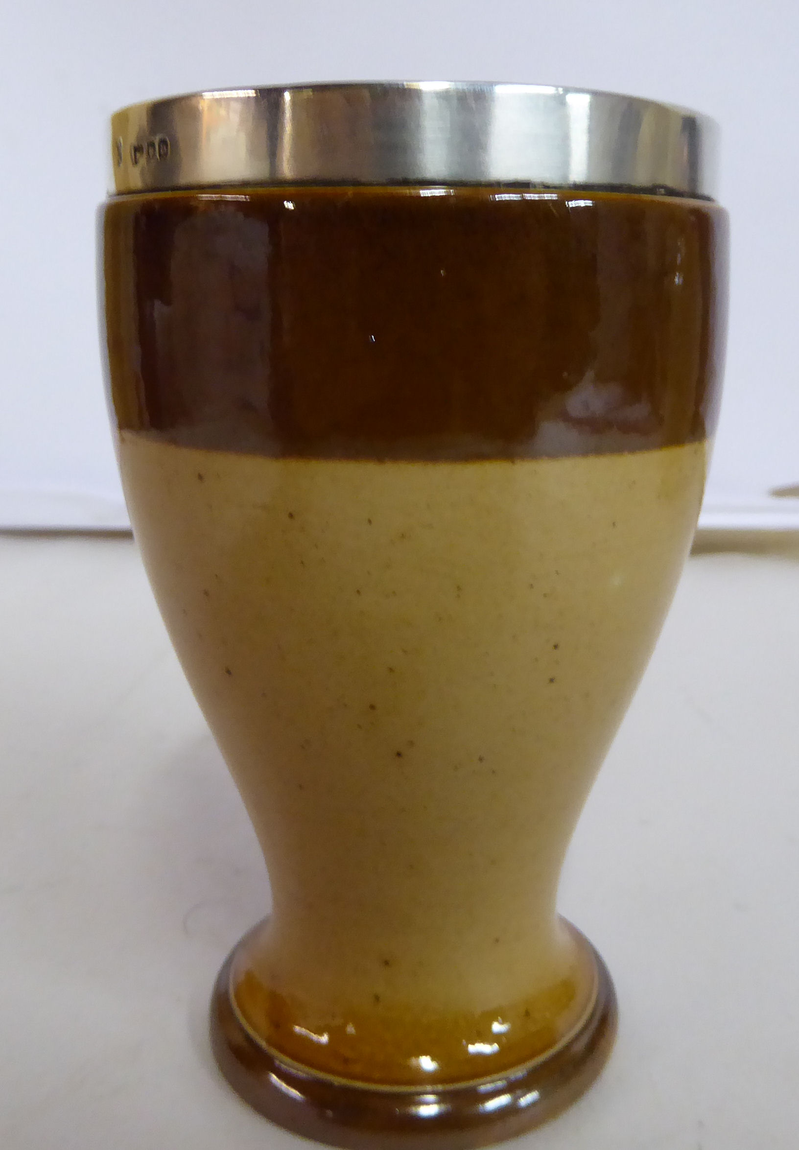 A Doulton Lambeth stoneware two tone brown glazed beaker of waisted baluster form with an applied - Image 3 of 5