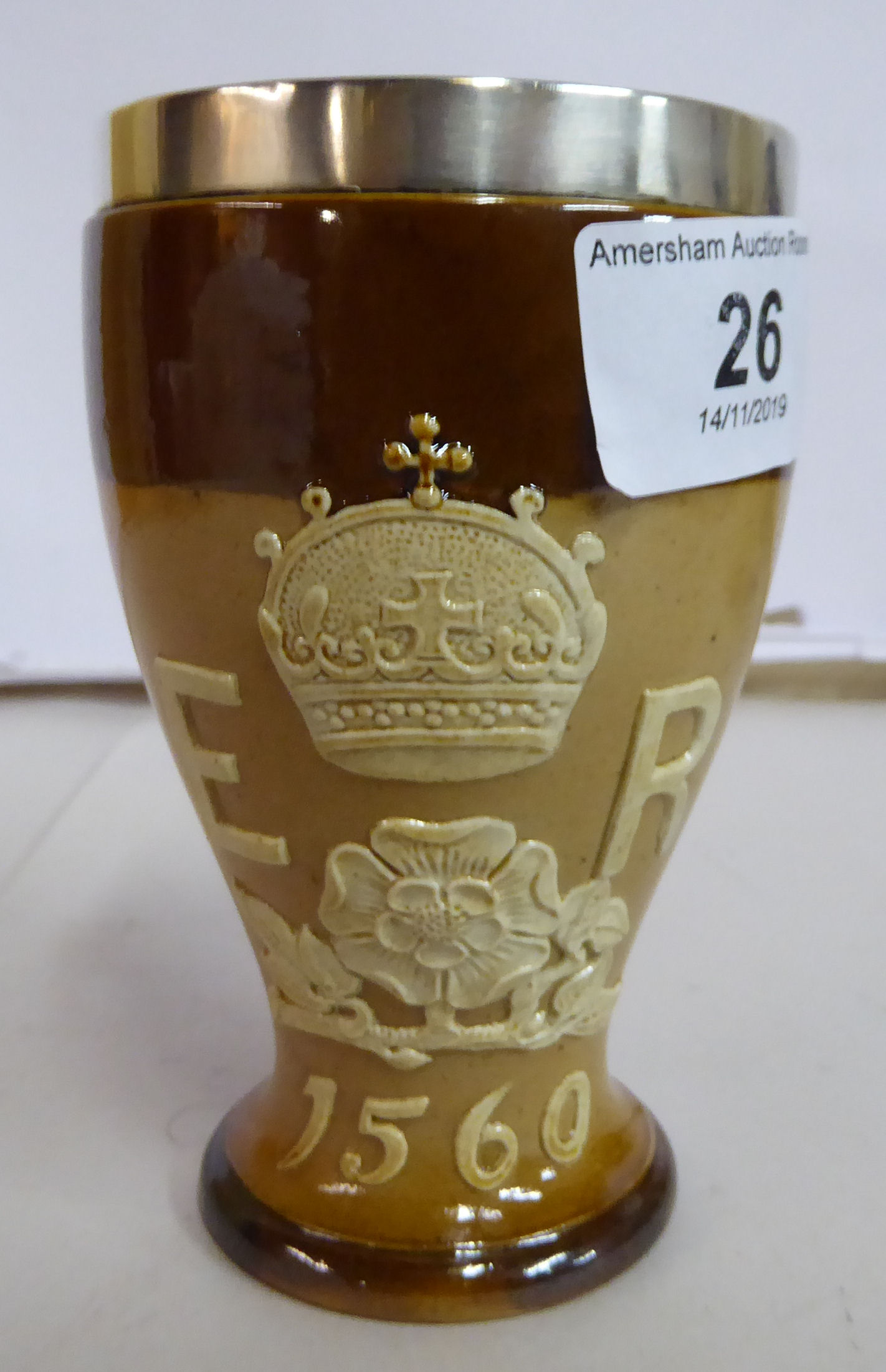 A Doulton Lambeth stoneware two tone brown glazed beaker of waisted baluster form with an applied - Image 2 of 5