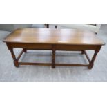 An Ercol light coloured elm coffee table,