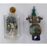 Asian collectables: to include a clear glass scent bottle; and another,