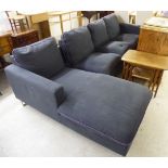 A modern charcoal coloured fabric upholstered, two part, four person L-shaped settee,