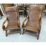 A pair of modern Colonial design fruitwood framed veranda chairs,