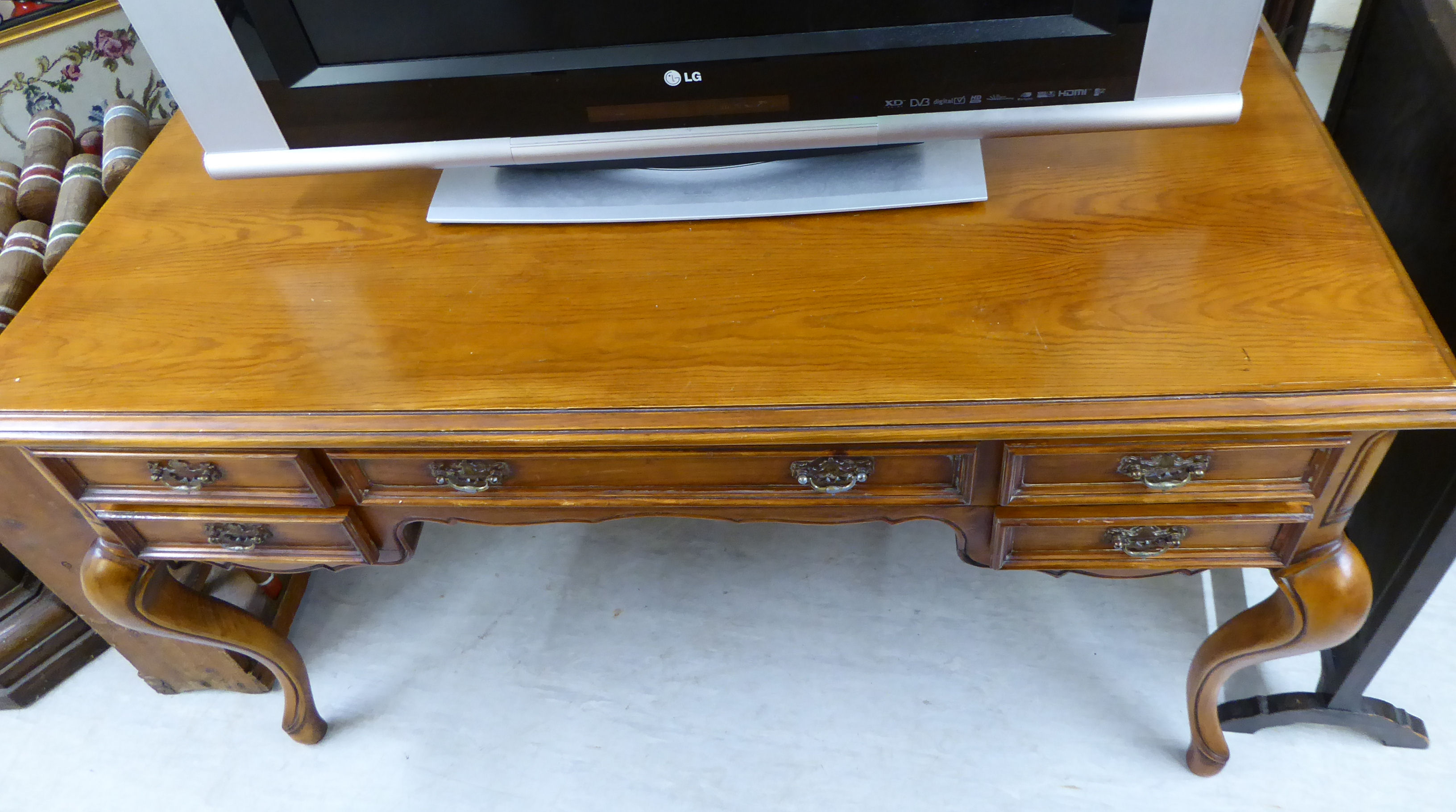 A modern Louis XV inspired mahogany finished kneehole desk with five graduated drawers, - Image 2 of 2