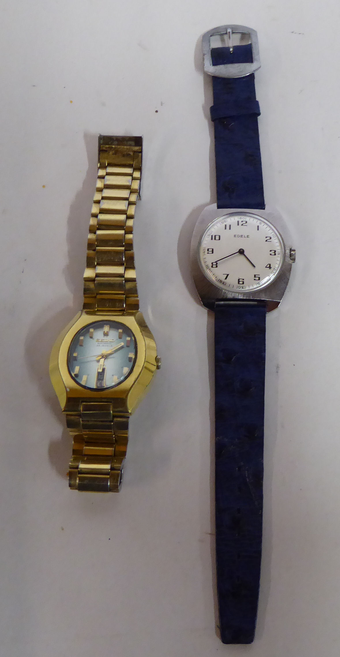 A Seiko gold plated cased bracelet wristwatch, the automatic movement faced by a baton dial,
