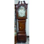 A mid 19thC mahogany longcase clock, the hood having a swan neck pediment and turned flank pillars,