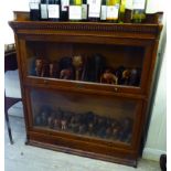 A 1920s oak Globe Wernicke style two tier glazed panelled bookcase,