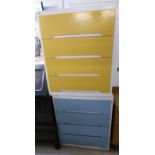 A pair of white, blue and yellow painted four drawer dressing chests,