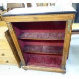A late Victorian inlaid mahogany pier cabinet, the open front enclosing two shelves,
