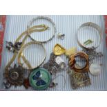 Personal ornaments: to include a white metal bangle,