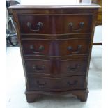 A modern Georgian style crossbanded mahogany four drawer bedside chest,