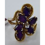 A 14ct gold amethyst and diamond set floral ring 11