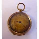 An Edwardian 14ct gold cased fob watch with engraved ornament,