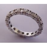 An 18ct white gold and diamond set full eternity ring