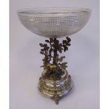 An early 20thC silver plated table centrepiece, featuring a stag beside an oak tree, on a circular,