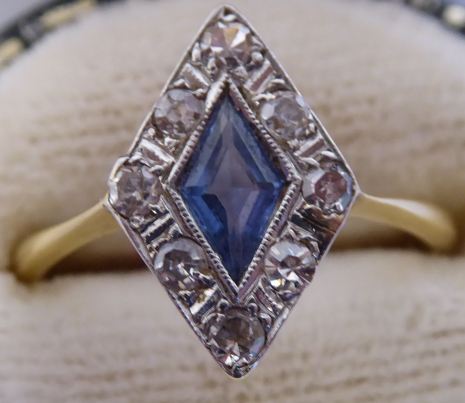 A 1920s 18ct gold and platinum lozenge shaped,