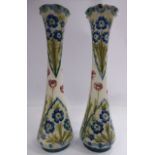 A pair of Moorcroft Macintyre Florian ware pottery vases of slender, waisted form with flared,