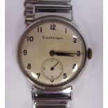 A 1948 Girard-Perregaux stainless steel cased wristwatch, faced by an Arabic dial and a subsidiary,