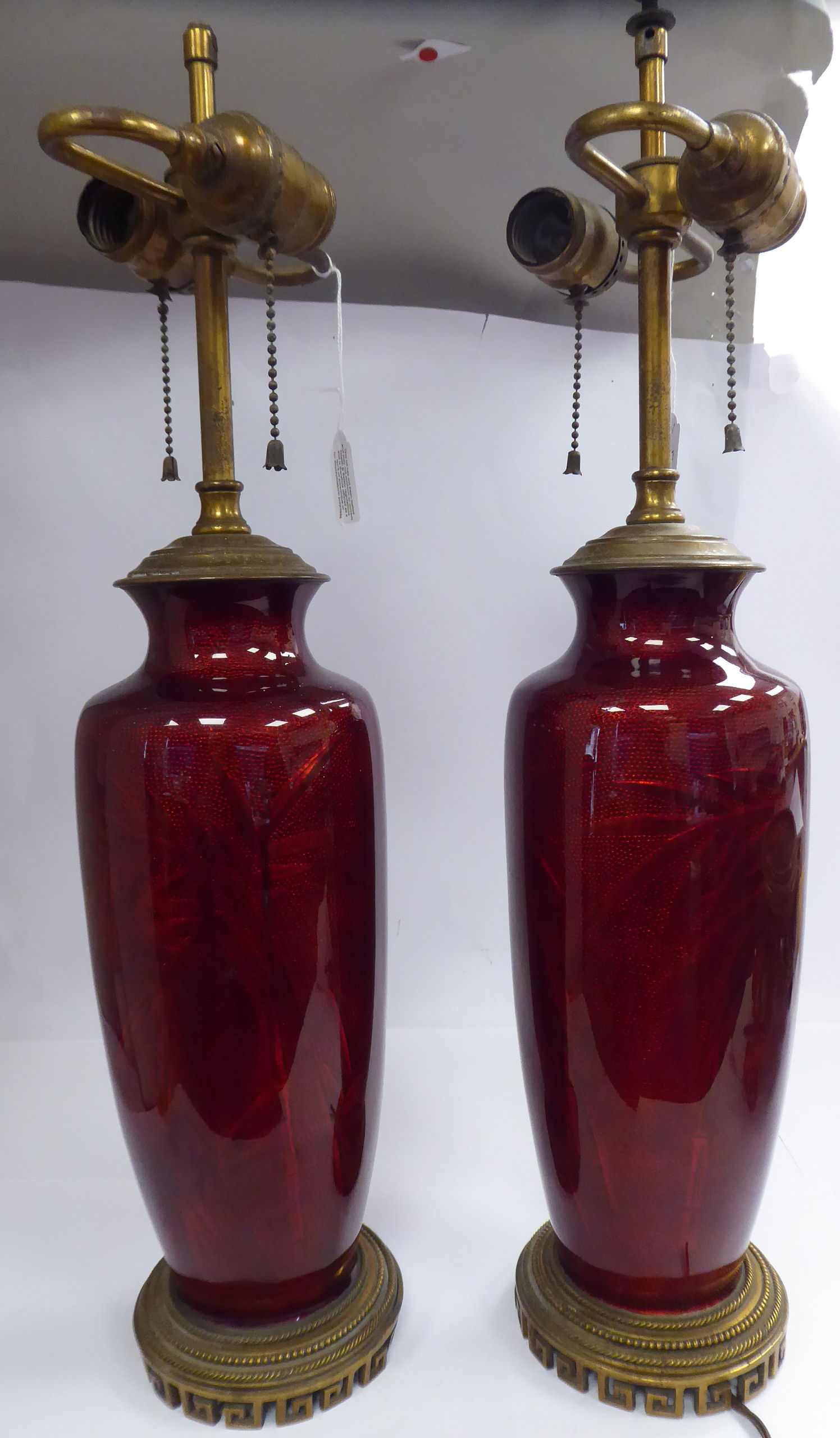 A pair of late 19th/early 20thC Continental burgundy coloured,