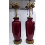 A pair of late 19th/early 20thC Continental burgundy coloured,