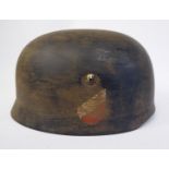 A German parachutist's camouflage helmet with a hide lining,