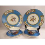 A pair of late 19thC French porcelain tea cups and saucers,