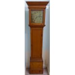 A country made waxed pine longcase clock, the hood having a straight cornice, over a glazed,