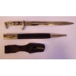 A German dress bayonet, having a cast white metal eagle's head pommel,