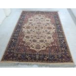 A Super Kashan rug, decorated with flora, foliage and other stylised designs,