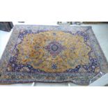 A Persian carpet with a central serpentine outlined medallion,