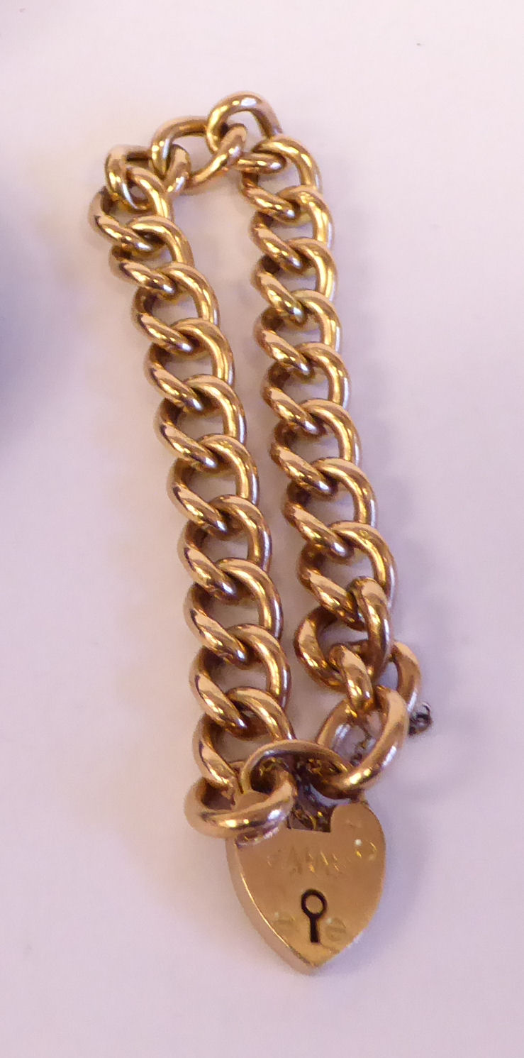 An Edwardian 9ct gold curb link bracelet,