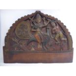 A 20thC Indian relief carved and painted, crescent shaped mahogany panel, featuring Kartikeya,