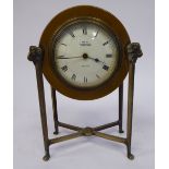 An Edwardian brass mantle timepiece (bearing traces of original silver plate) the drum shaped case