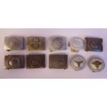 Ten various German military uniform belt buckles bearing an assortment of swastika,