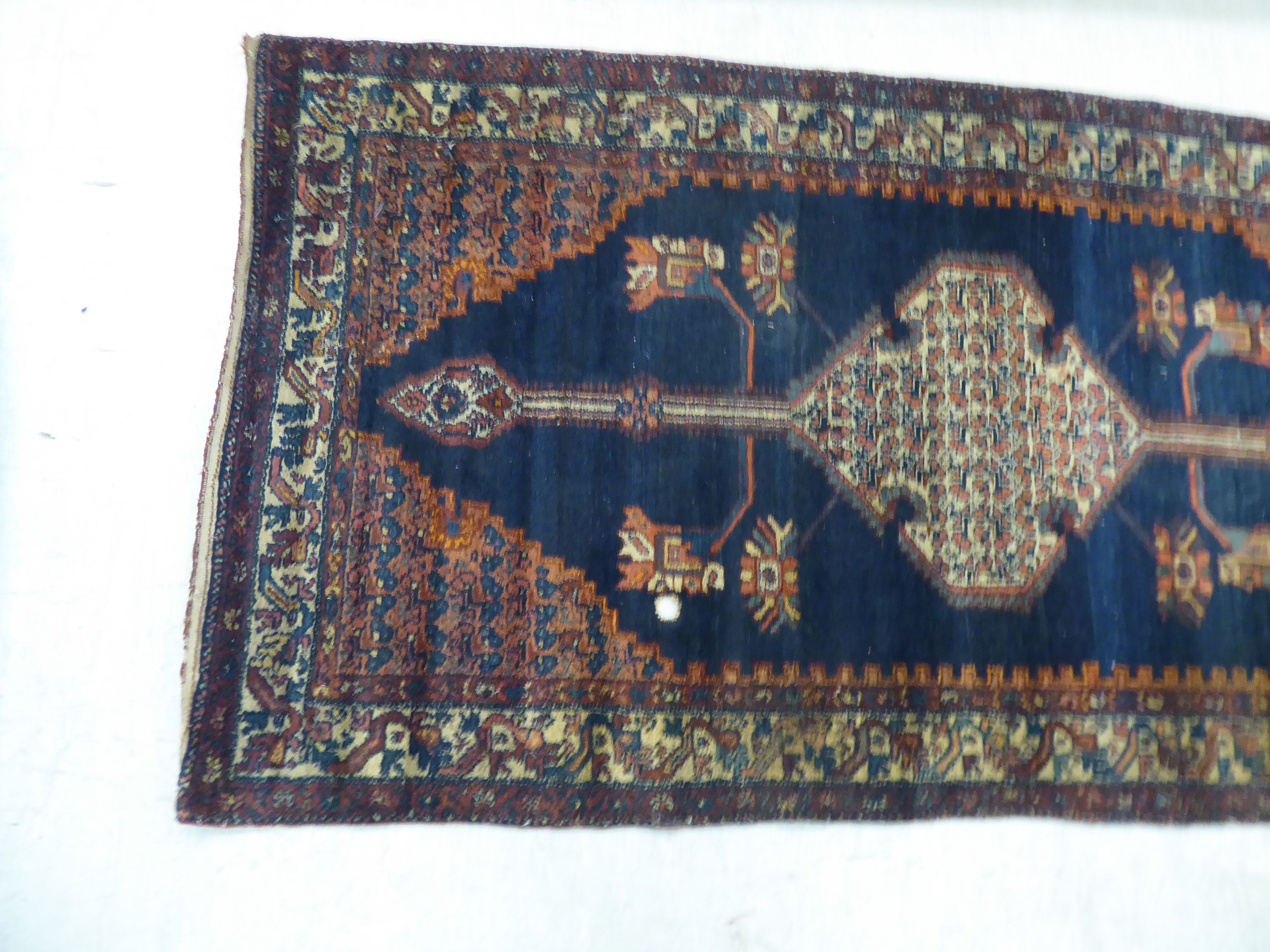 A Persian rug, decorated with a central medallion and four corners of stylised designs, - Image 3 of 4