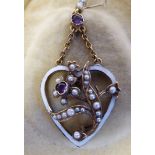 A Victorian 15ct gold and white enamel heart shaped pendant, set with amethysts and seed pearls,