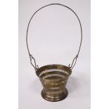 A silver basket frame, having pierced, tapered sides,