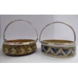 A pair of similar late Victorian Doulton Lambeth stoneware wine coaster design bowls,