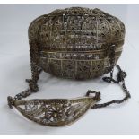 A late 19thC Chinese filigree worked silver oval covered casket, on four suspension chains 4.
