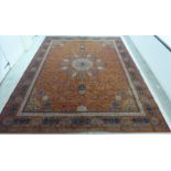 A Grosvenor Wilton pattern, Persian inspired carpet, decorated with a central medallion,