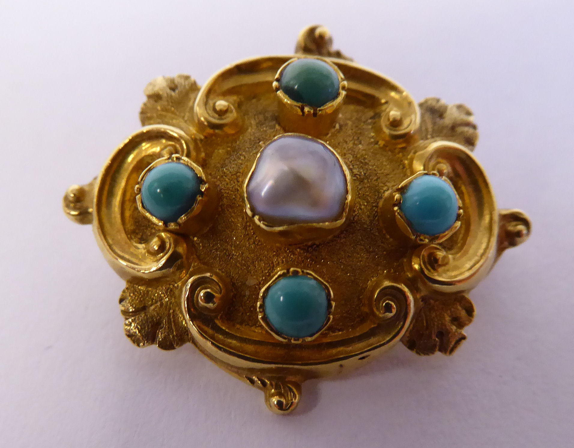 An early Victorian 15ct gold cast and textured brooch,