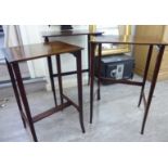 A nesting set of three early/mid 20thC mahogany occasional tables with string inlaid and