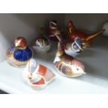 Seven Royal Crown Derby china bird paperweights, five with gilt stoppers,