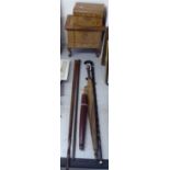 A mixed lot: to include three variously made walking sticks BSR