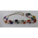 A yellow metal and multi-coloured stone necklace,