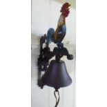 A cast iron door bell, surmounted by a painted cockerel,