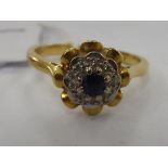 An 18ct gold sapphire and diamond set petal ring 11