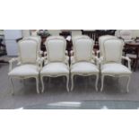 A set of eight cream painted, showwood framed spoonback dining chairs with open arms,