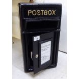 A black painted cast iron postbox 17.5''h 9.