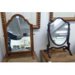 Two similar mahogany dressing table mirrors, each with an arched plate,